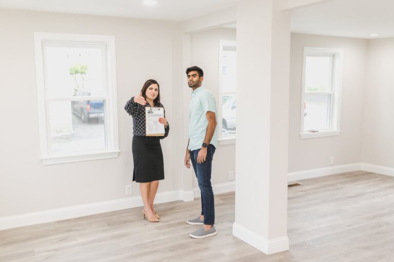 woman showing the inside of house to a man