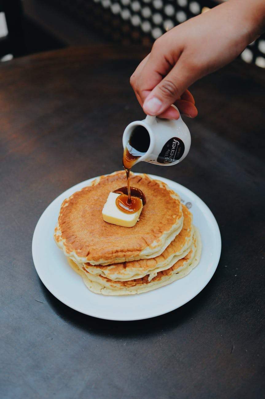 person pouring syrup on pancake 3 easy pancake recipes pancakes recipe cooking baking breakfast food