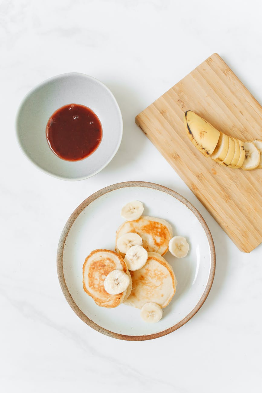 photo of pancakes with banana on white ceramic plate 3 easy pancake recipes pancakes recipe cooking baking breakfast food